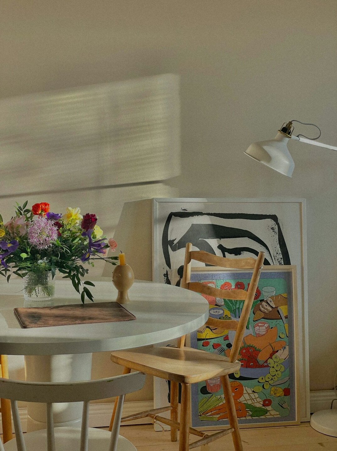Planning notebook with a calendar and a tablet on a table in a sunny room