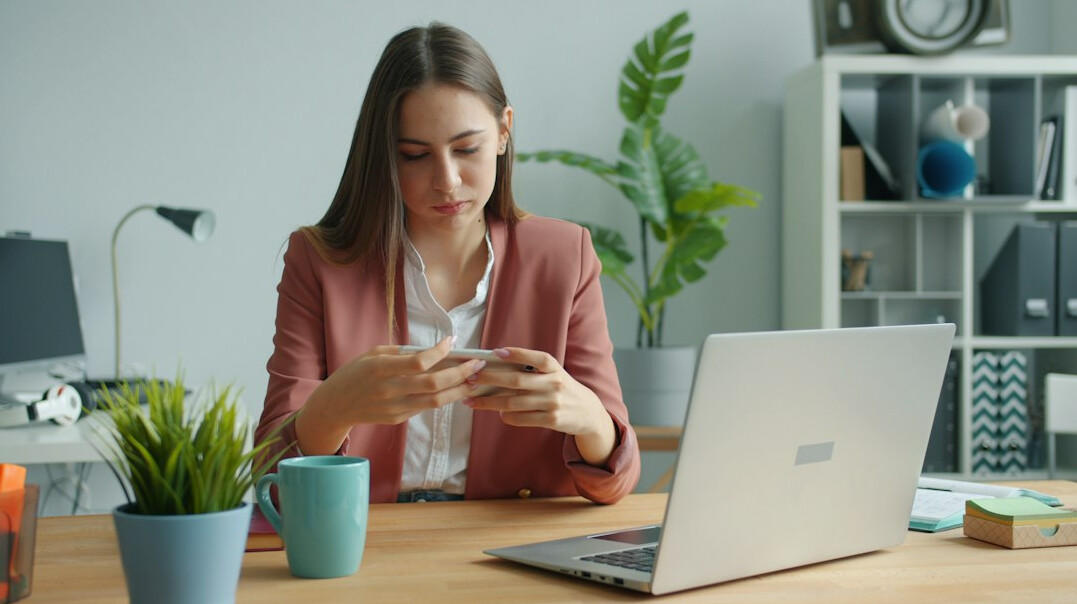 person reviewing bank statements at desk