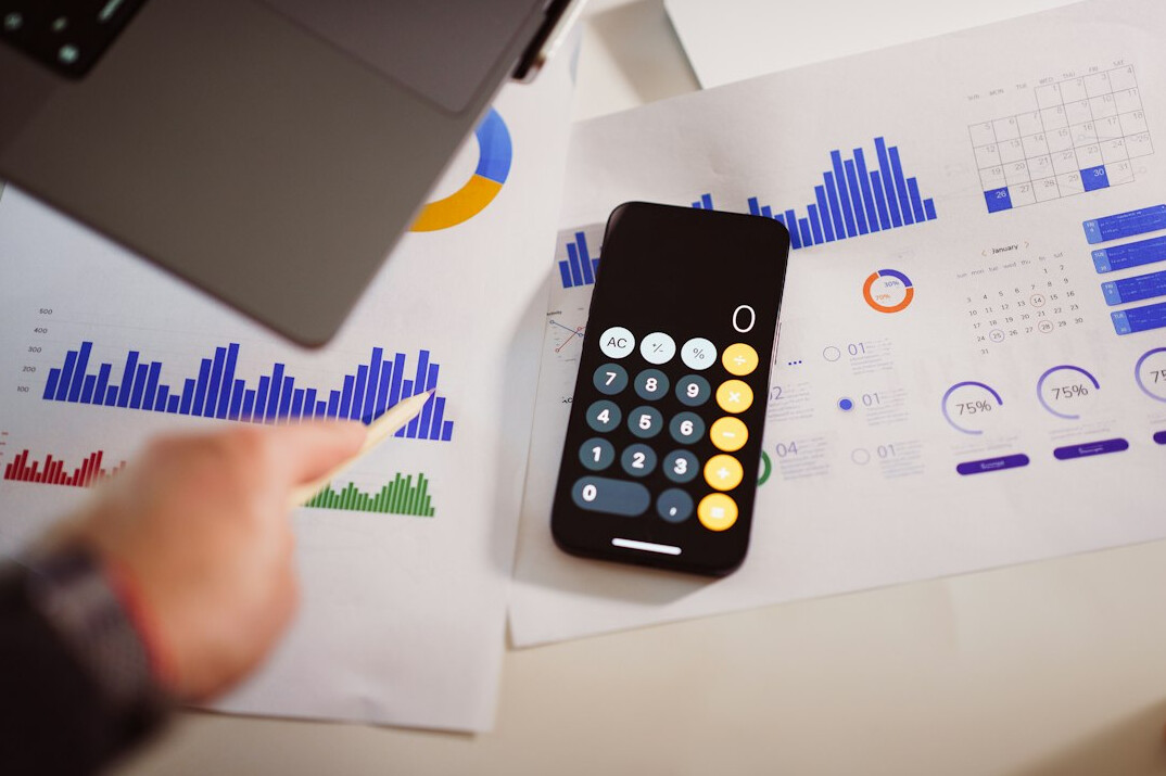 person using financial calculator