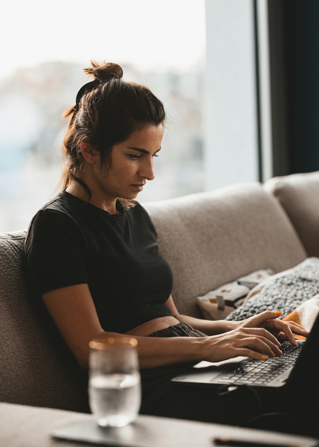 woman checking finances on laptop